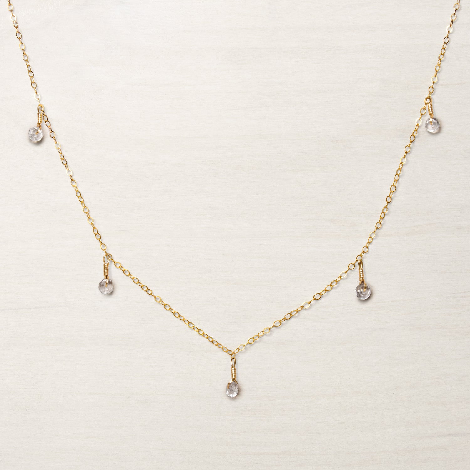 dainty gold chain princess necklace with clear quartz