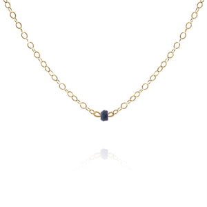 gold choker necklace with dainty sapphire gemstone