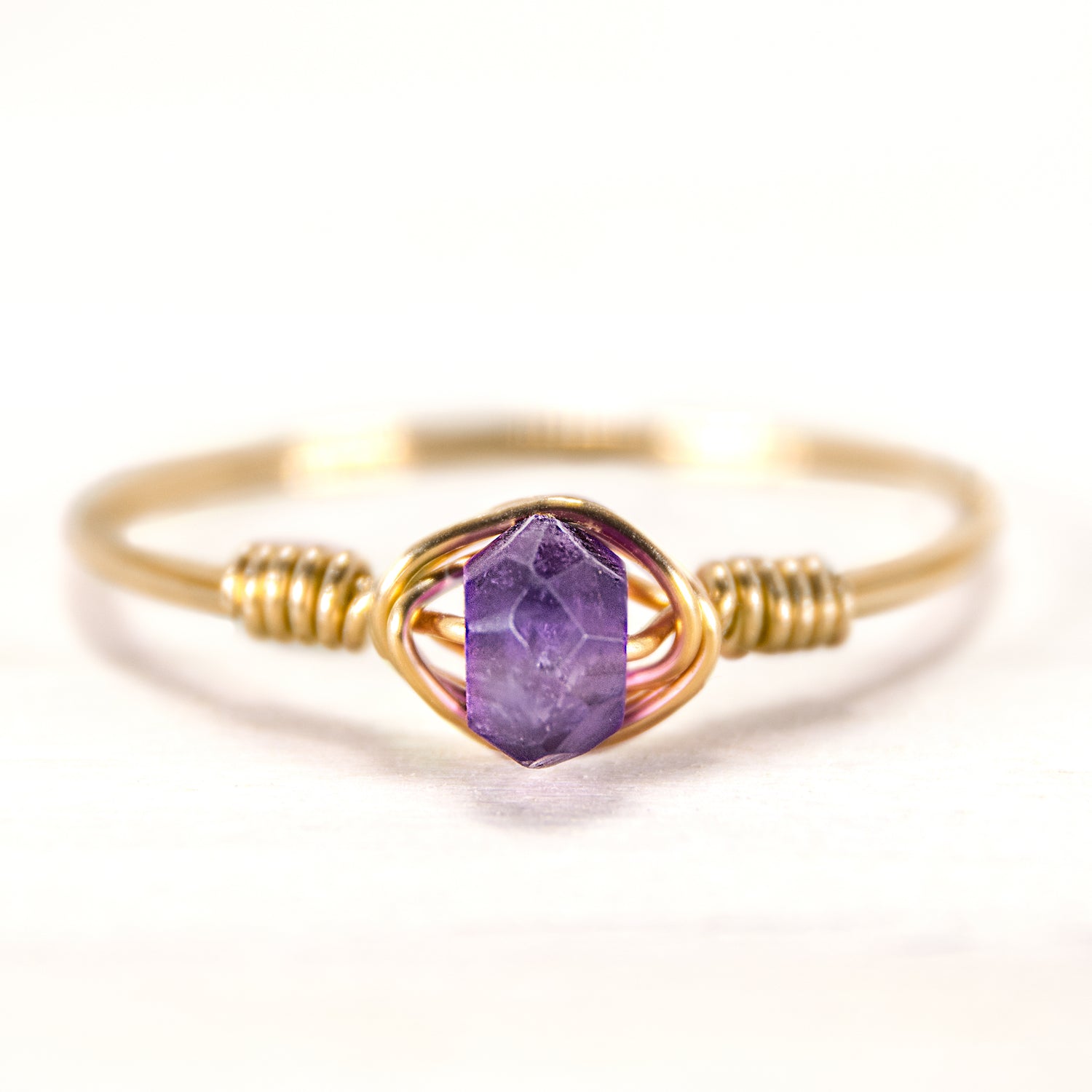 gemstone ring with amethyst in gold wire