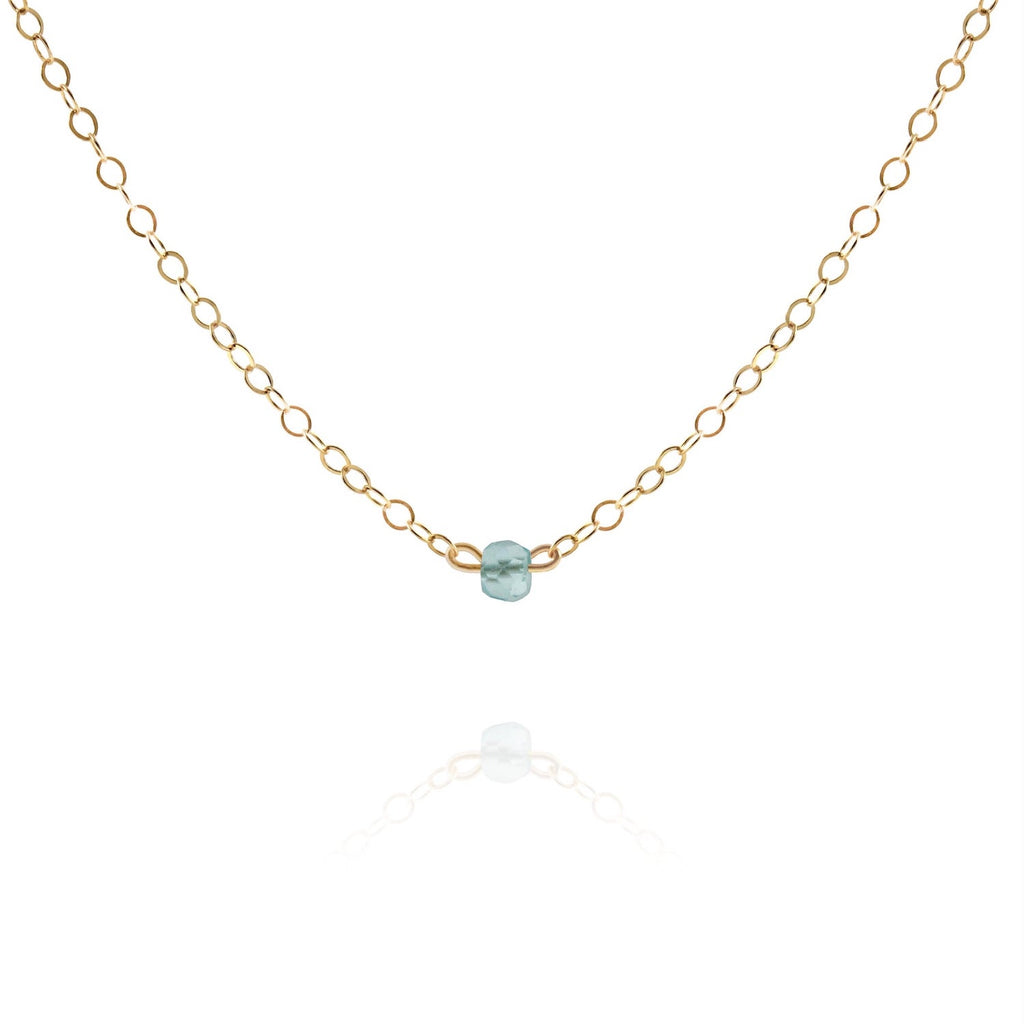 gold choker necklace with dainty aquamarine gemstone