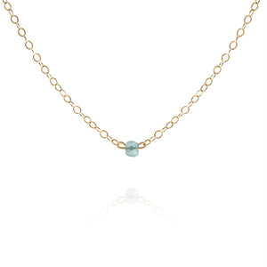 gold choker necklace with dainty aquamarine gemstone