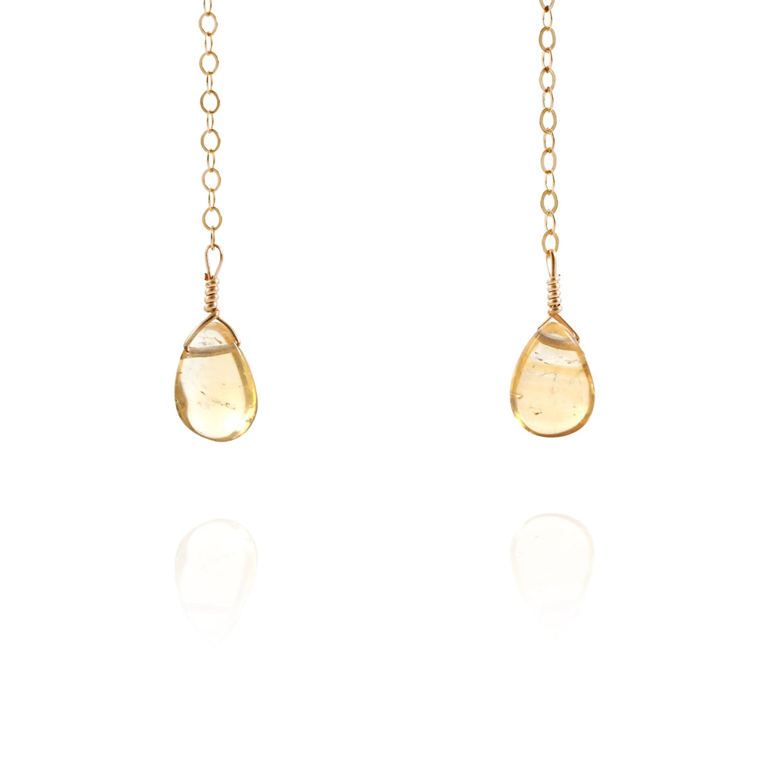 gold dangly earrings with gemstones